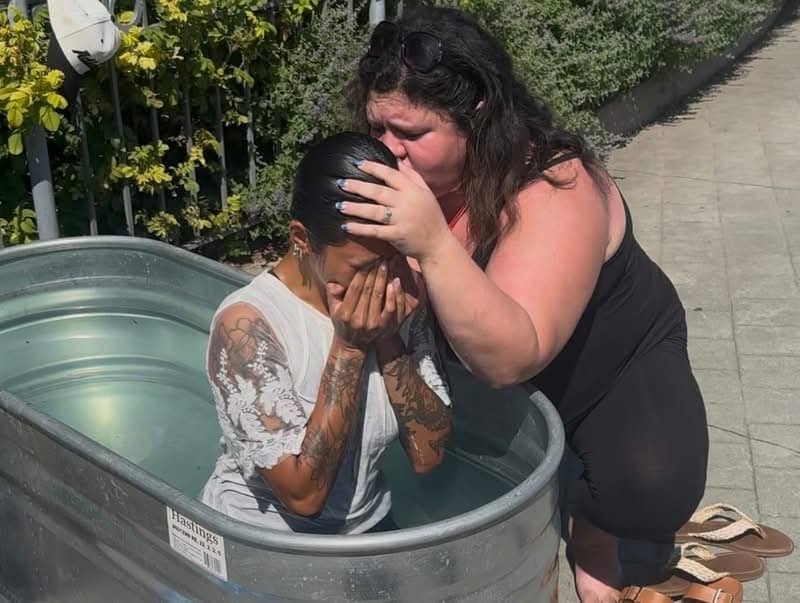 A woman held and prayed over in the baptism tank, Jesus Festival Hamilton 2026