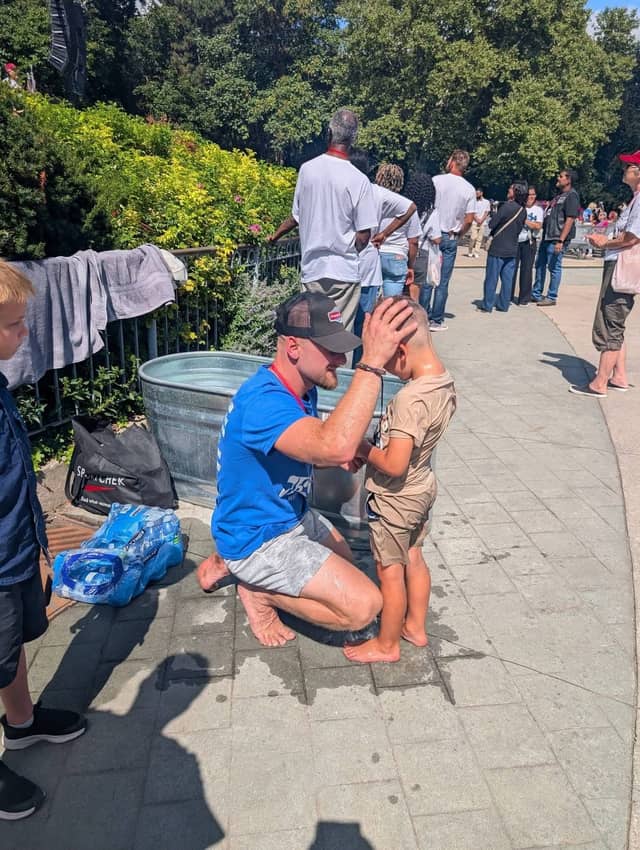 A boy prayed over after his baptism, with the line still waiting behind him, Jesus Festival Hamilton 2026