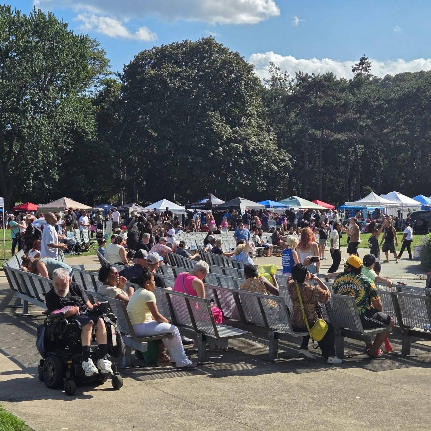 The crowd in front of the bandshell with the vendor row behind, Jesus Festival Hamilton 2026