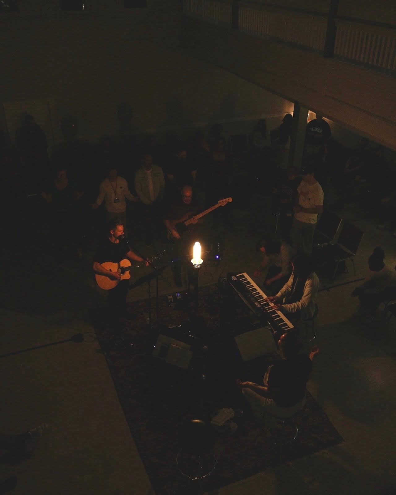 Friday Night Prayer musicians worshipping around the light